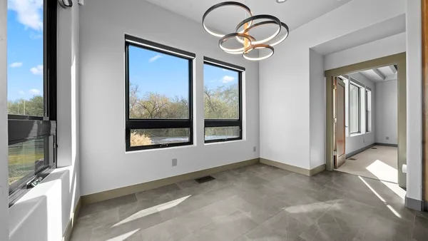 a view of a livingroom with furniture and front door