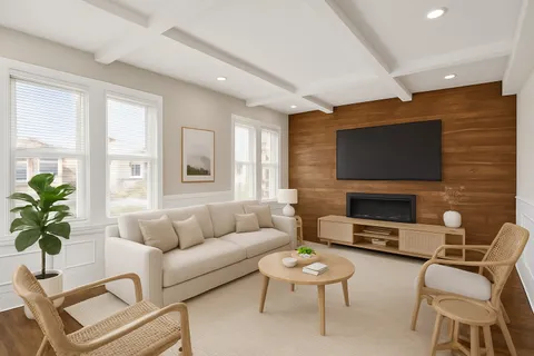 a living room with fireplace furniture and a flat screen tv