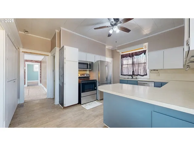 a kitchen with sink and cabinets