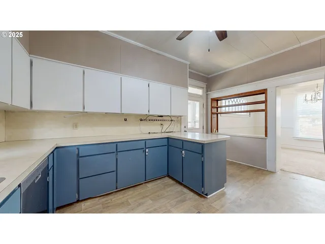 a kitchen with a refrigerator and a sink
