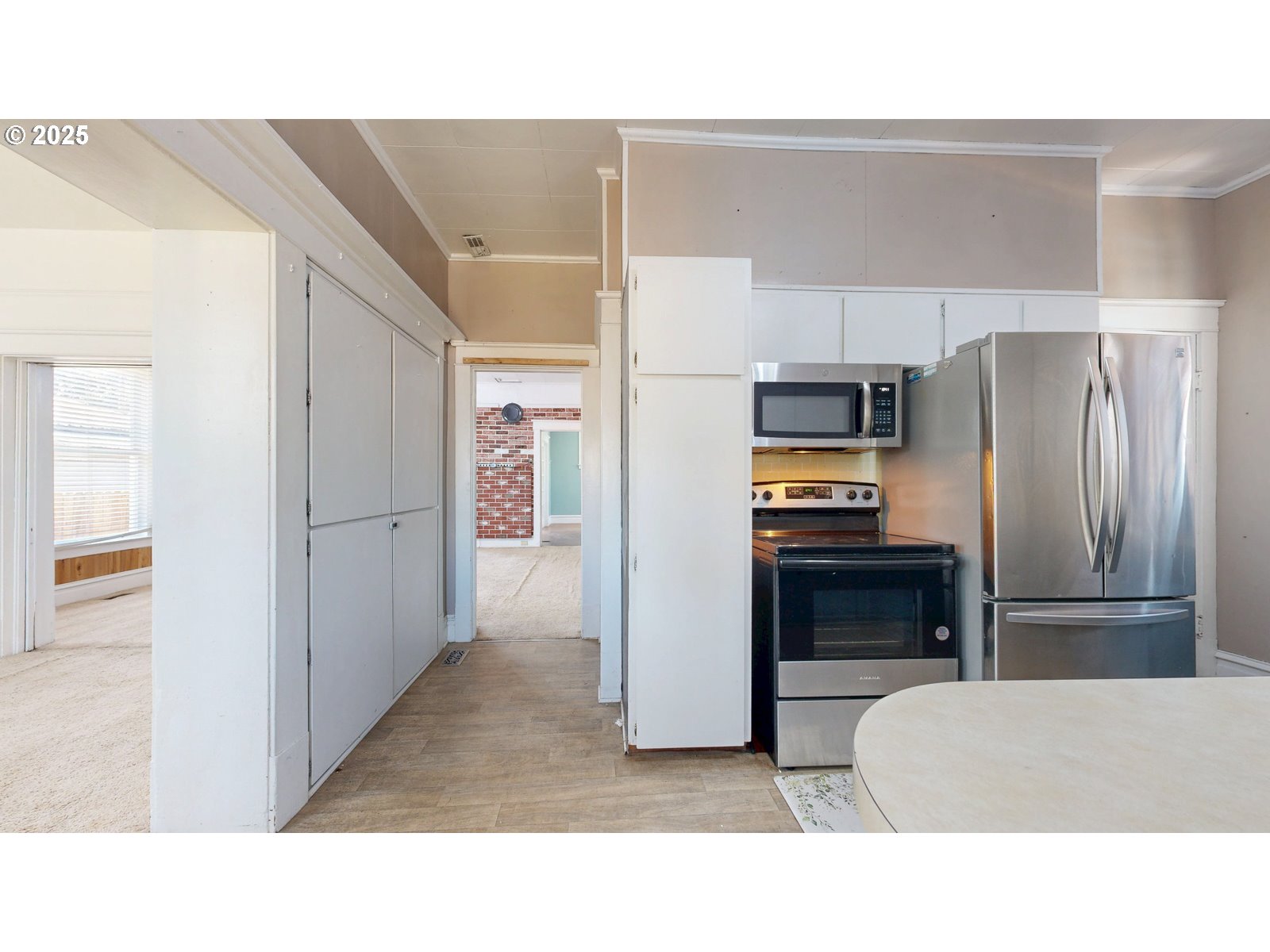 2438 Auburn Avenue Baker City, OR 97814 - Photo 21 of 41 a kitchen with a refrigerator and a sink