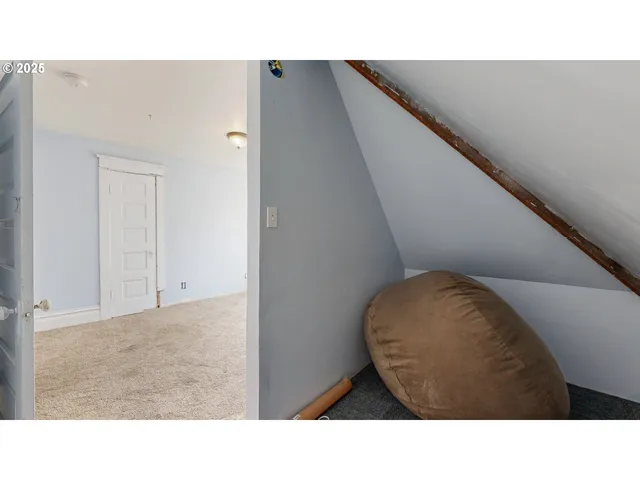 a living room with a couch and dresser