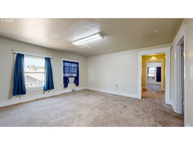 a living room with a couch and large window