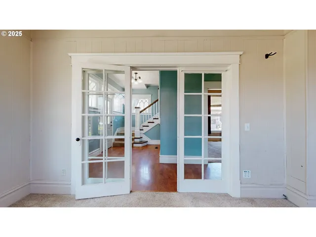 a open living room with a window and a bath tub
