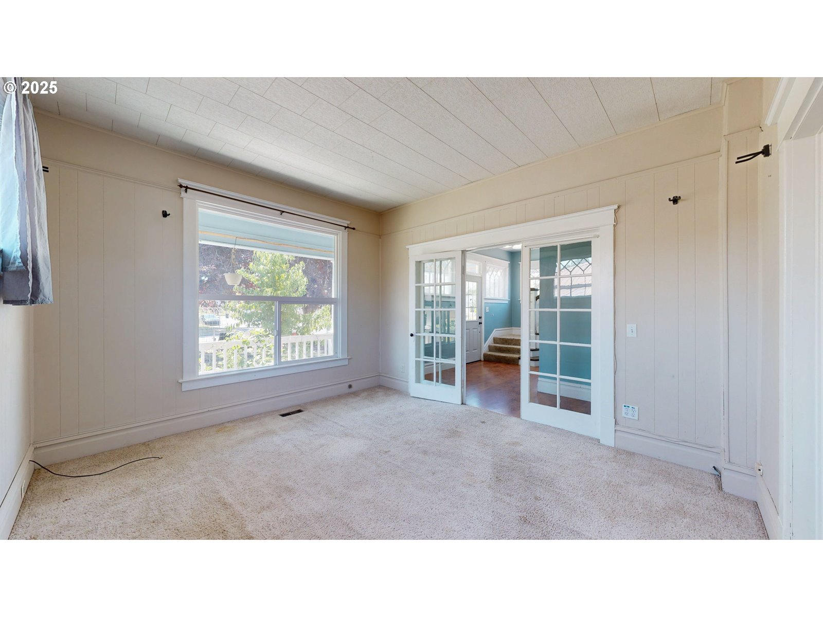 2438 Auburn Avenue Baker City, OR 97814 - Photo 9 of 41 a open hall with a floor to ceiling window and a living room