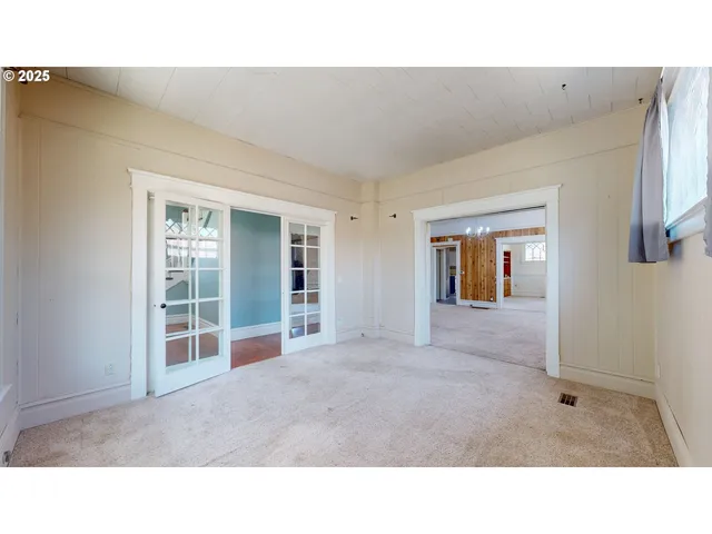 a living room with furniture and windows