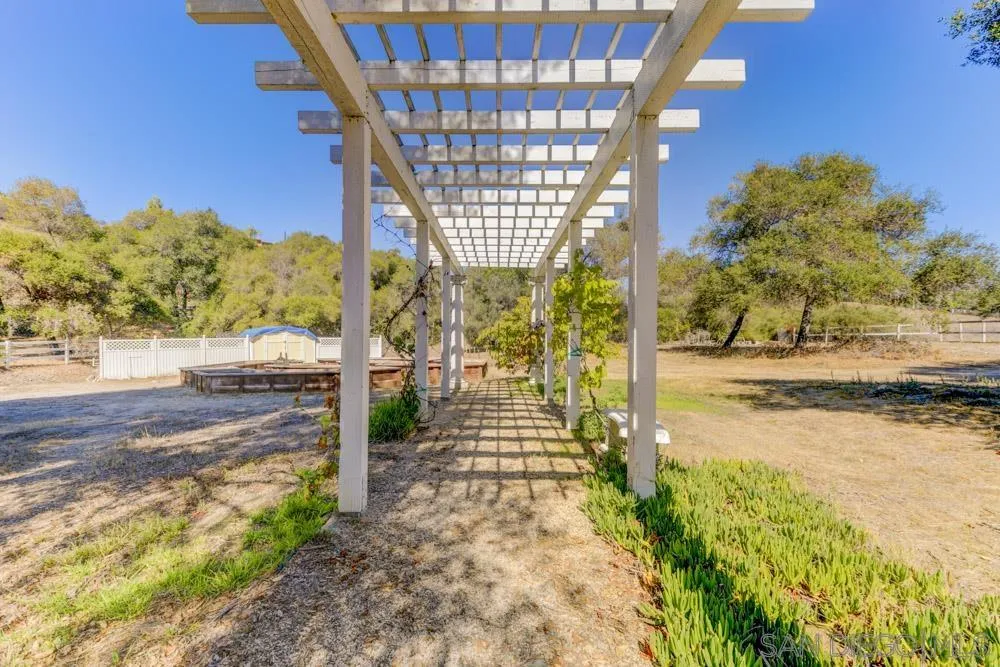 4735 Olive Hill Road Fallbrook, CA 92028 - Photo 20 of 22 a view of a pathway with a yard