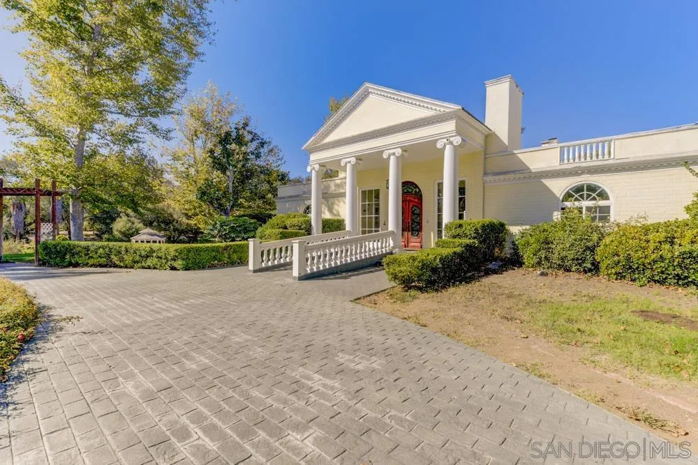 4735 Olive Hill Road Fallbrook, CA 92028 - Photo 2 of 22 a view of a house with backyard and plants