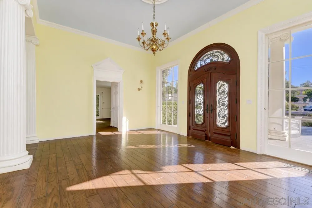 4735 Olive Hill Road Fallbrook, CA 92028 - Photo 6 of 22 a view of a livingroom with wooden floor and a chandelier