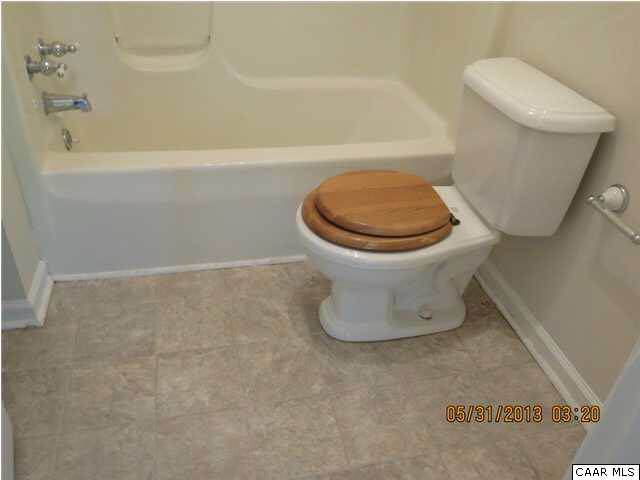 1535 Simms Road Stanardsville, VA 22973 - Photo 8 of 12 a bathroom with a toilet and a bathtub