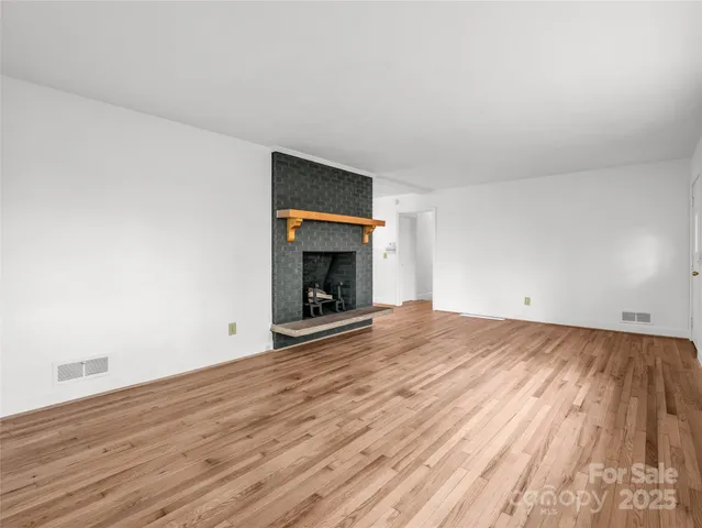 a view of room with wooden floor