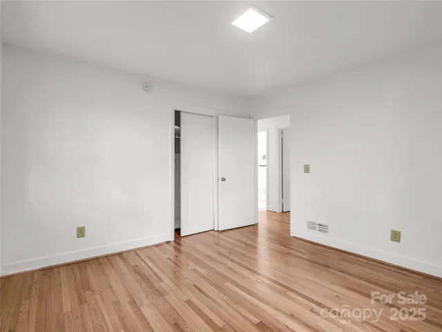 a bathroom with a sink toilet a mirror and shower