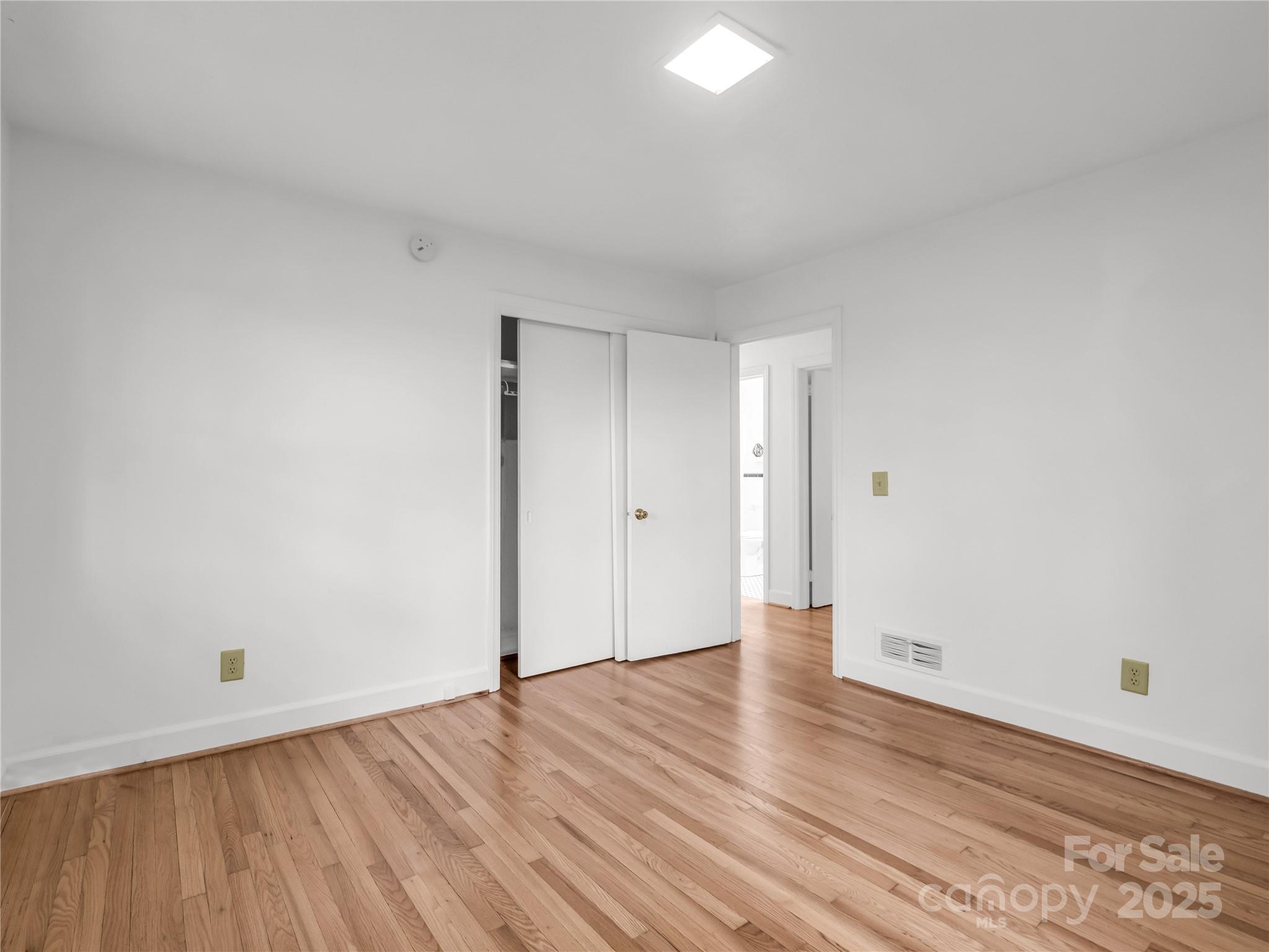 200 Little Wings Mountain Road Columbus, NC 28722 - Photo 20 of 42 a view of an empty room with wooden floor