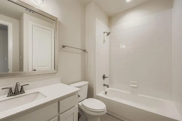 a bathroom with a sink a toilet and a bathtub