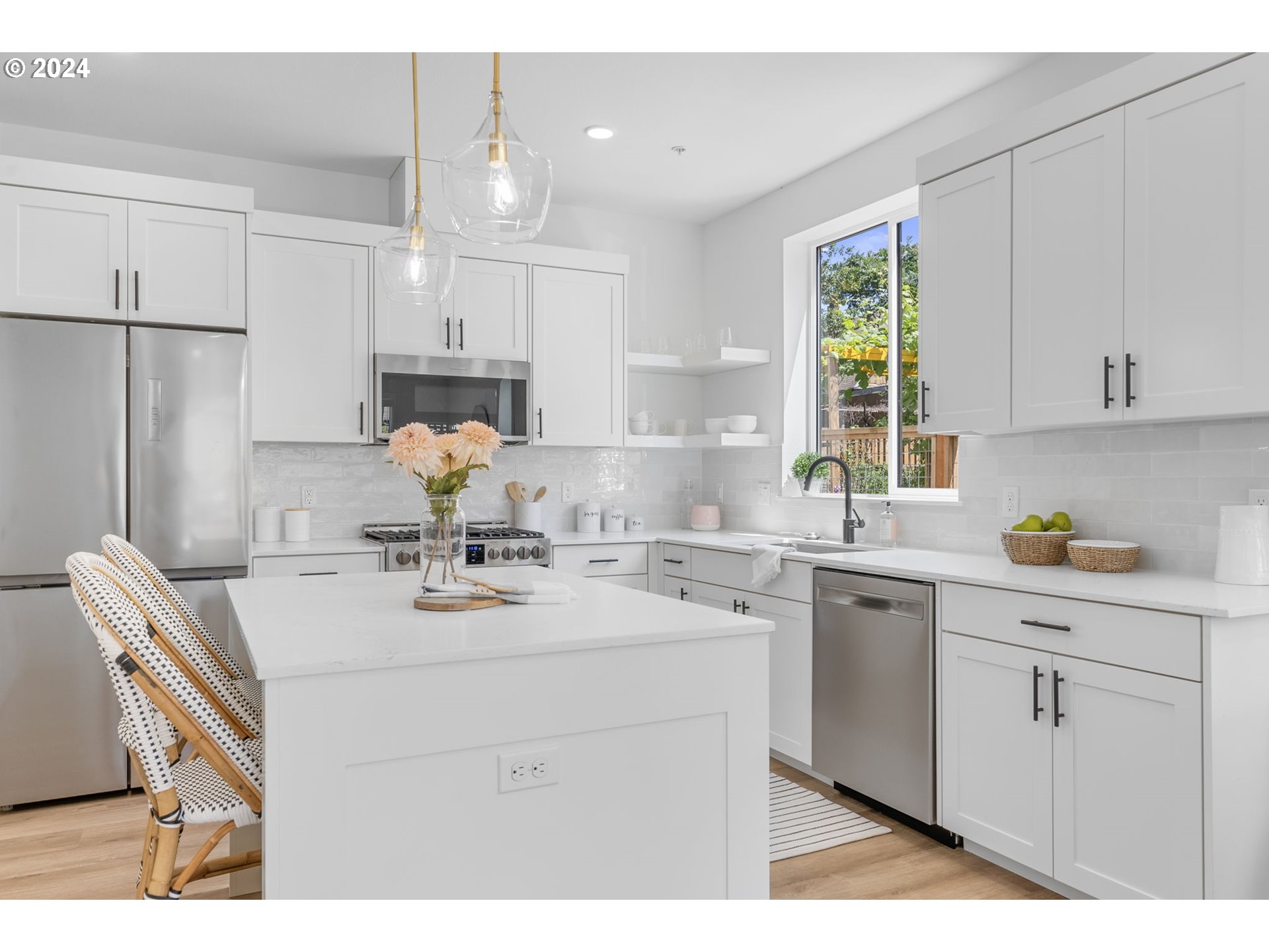 121 North Going Street, Unit 202 Portland, OR 97217 - Photo 11 of 30 a kitchen with a sink a stove a refrigerator and cabinets