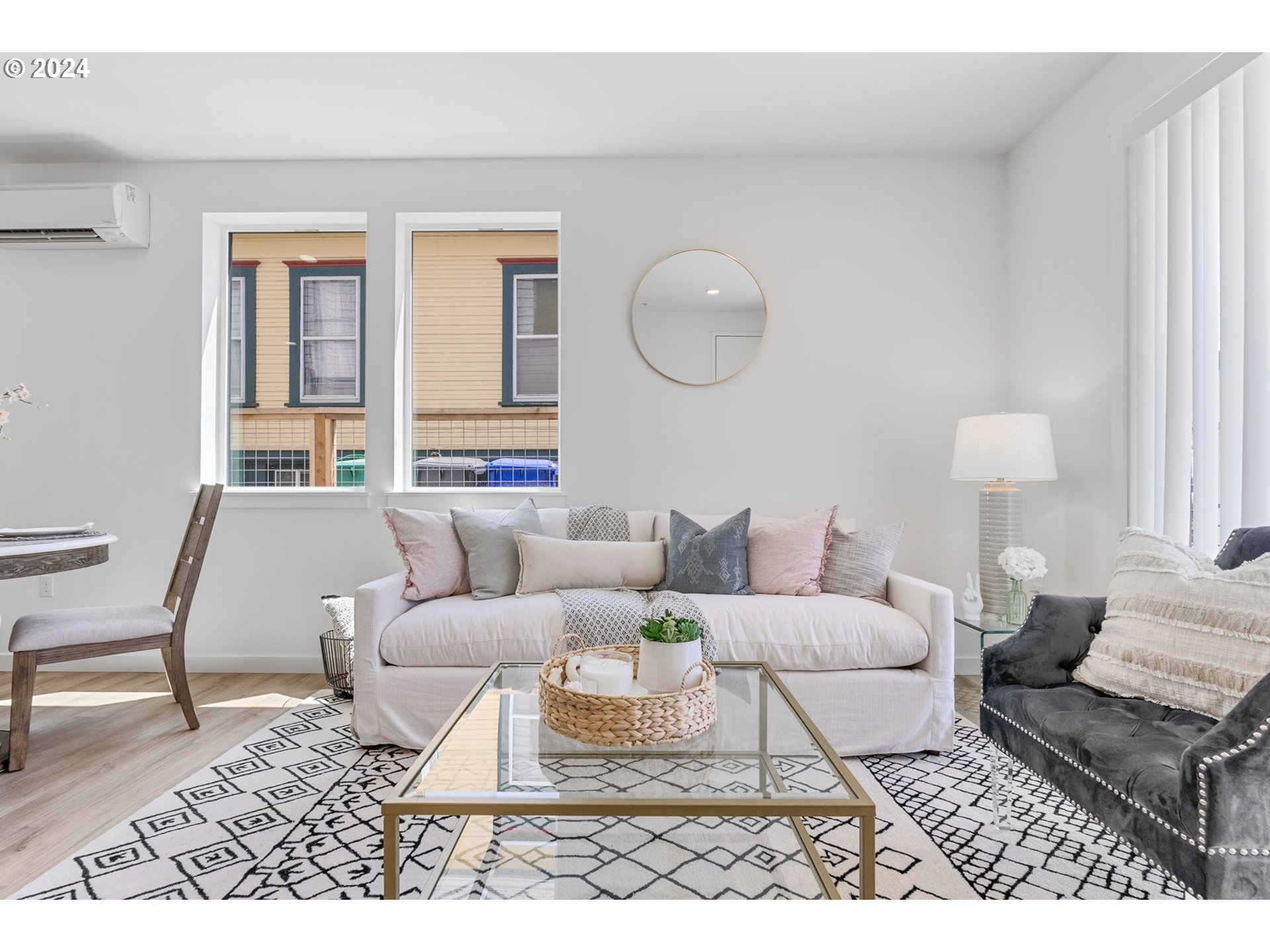 121 North Going Street, Unit 202 Portland, OR 97217 - Photo 27 of 30 a living room with furniture a rug and a window