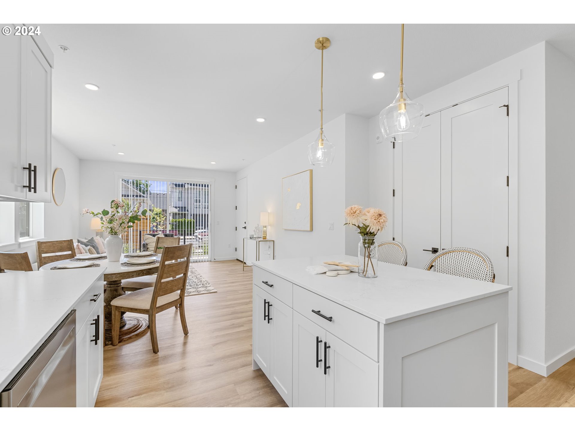 121 North Going Street, Unit 202 Portland, OR 97217 - Photo 6 of 30 a view of kitchen island with stainless steel appliances kitchen island dining table and chairs