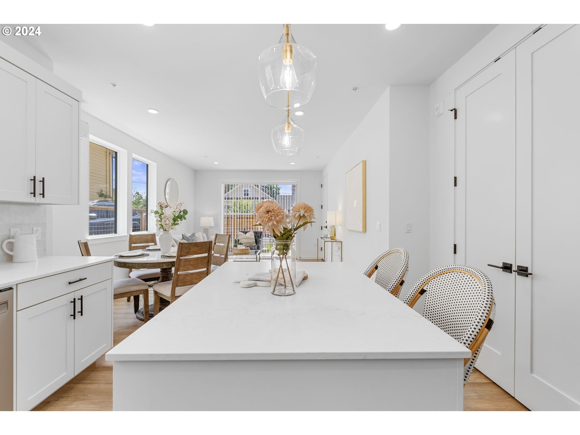121 North Going Street, Unit 202 Portland, OR 97217 - Photo 7 of 30 a kitchen with kitchen island a sink appliances and cabinets