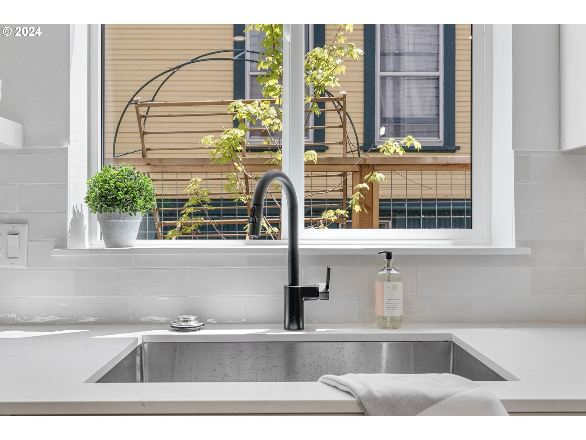 121 North Going Street, Unit 202 Portland, OR 97217 - Photo 10 of 30 a view of a window and a potted plant