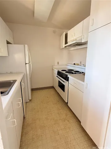 a kitchen with a stove a washer and dryer