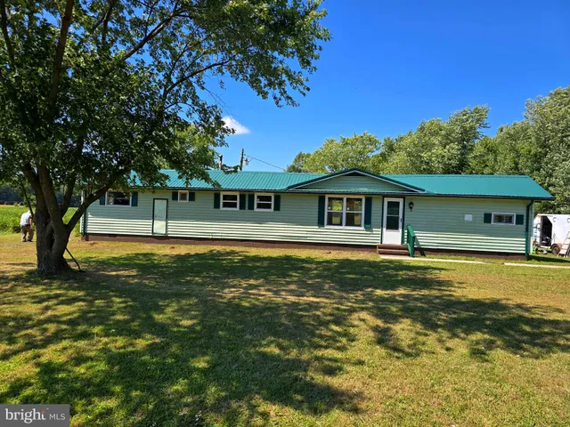 a front view of a house with swimming pool