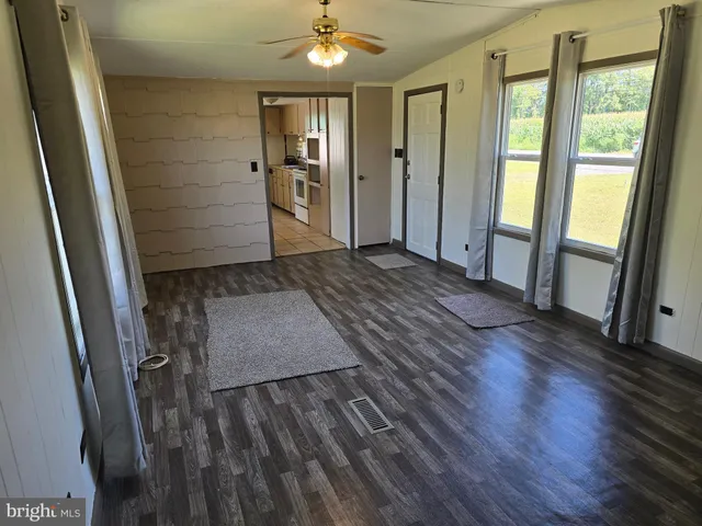 a view of entryway with wooden floor