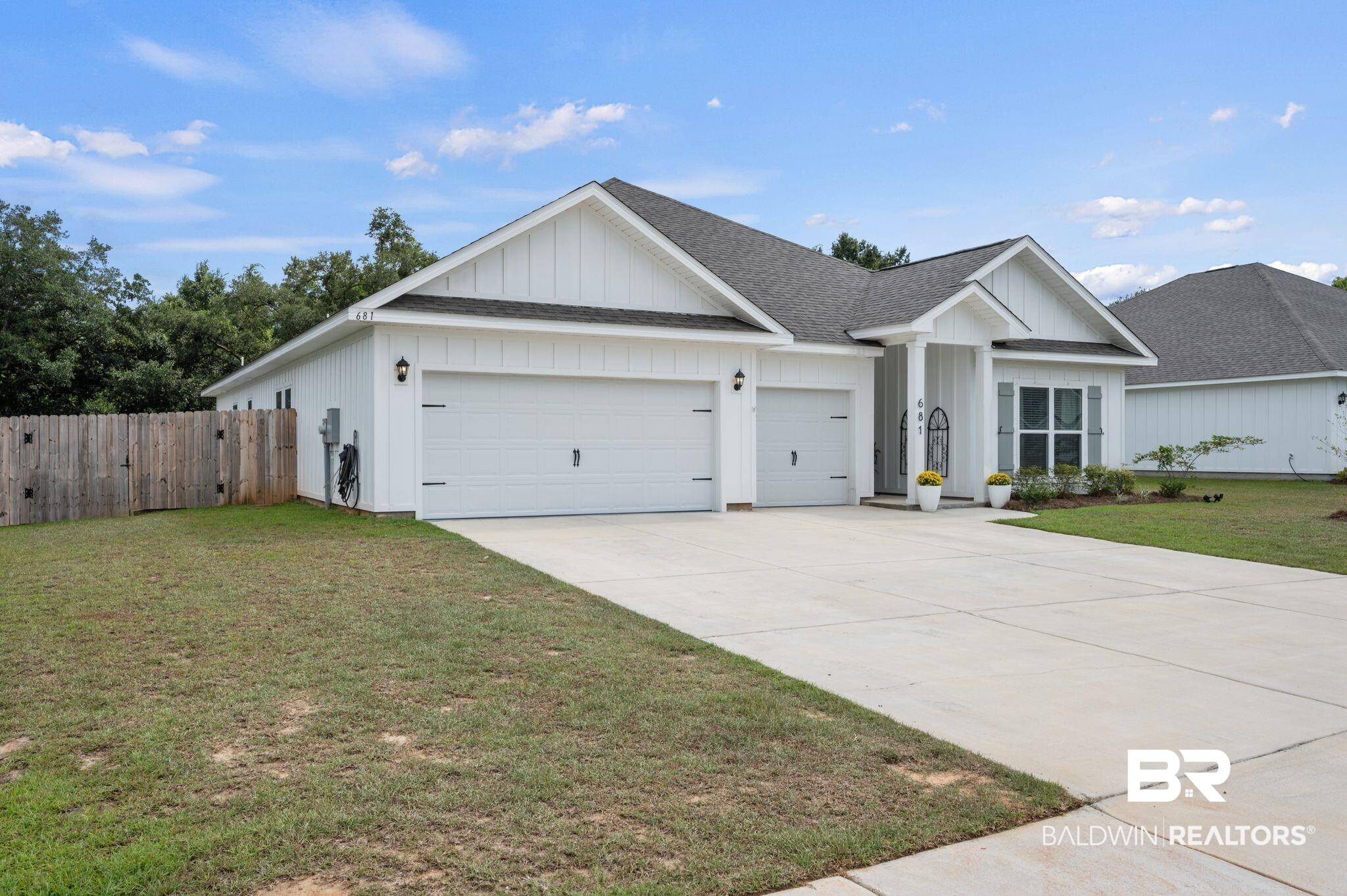 681 Calibre Street Fairhope, AL 36532 - Photo 2 of 56 Ranch-style house featuring a garage and a front lawn