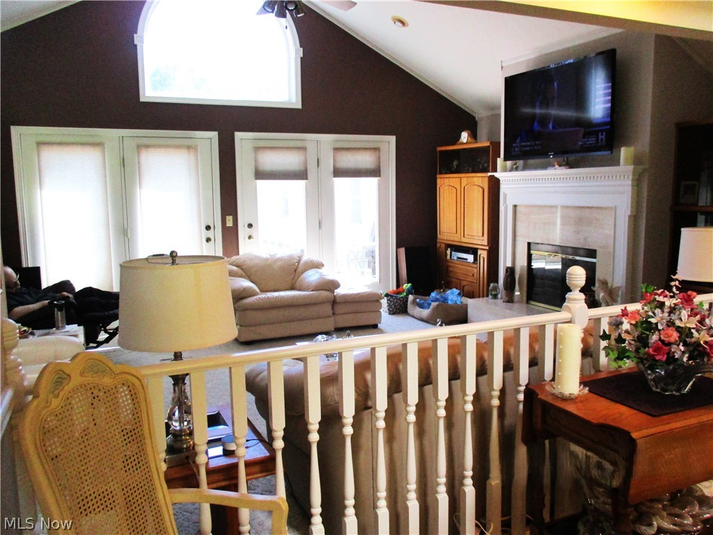 7540 Kennard Road Seville, OH 44273 - Photo 16 of 37 Living room with a wealth of natural light, ceiling fan, vaulted ceiling, and french doors