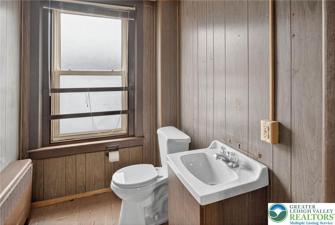 1106 Broadway Bethlehem, PA 18015 - Photo 17 of 25 a bathroom with a toilet sink and mirror