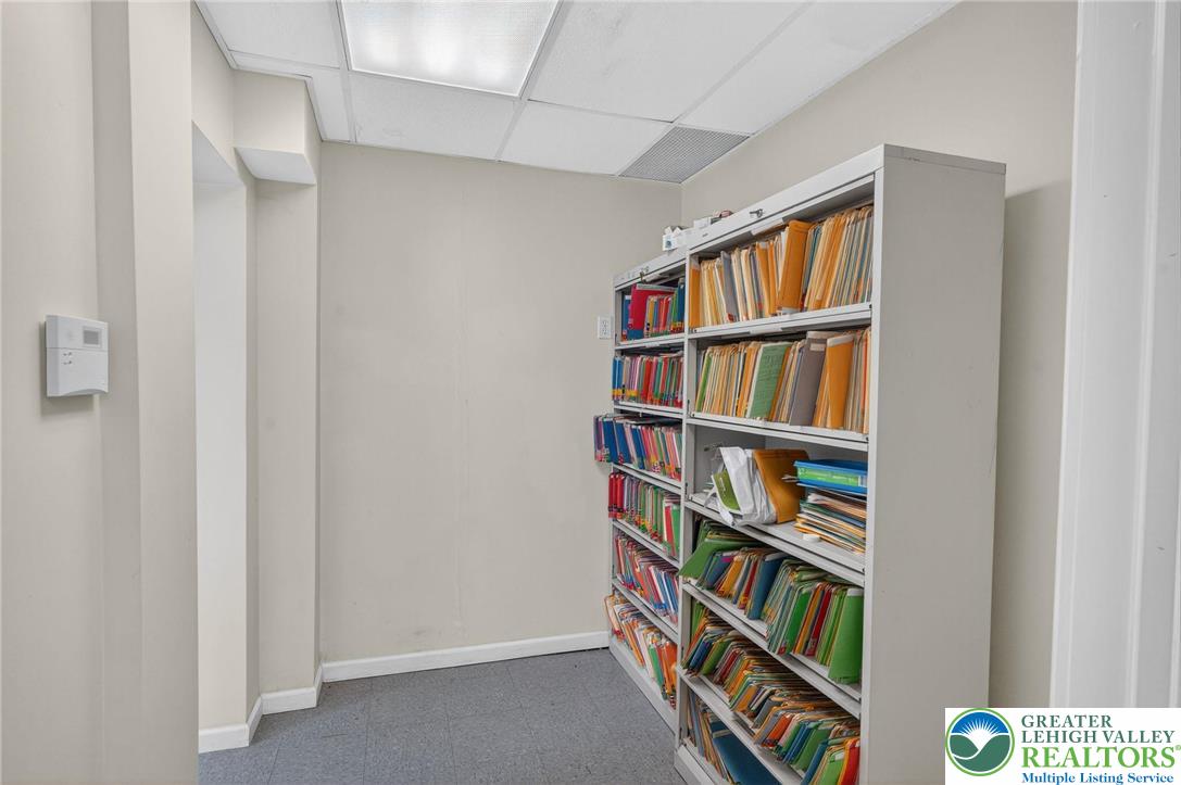 1106 Broadway Bethlehem, PA 18015 - Photo 4 of 25 a room with bookshelf and a book shelf