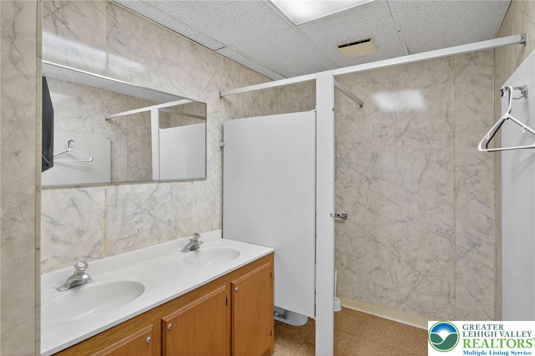 1106 Broadway Bethlehem, PA 18015 - Photo 8 of 25 a bathroom with a sink and a mirror