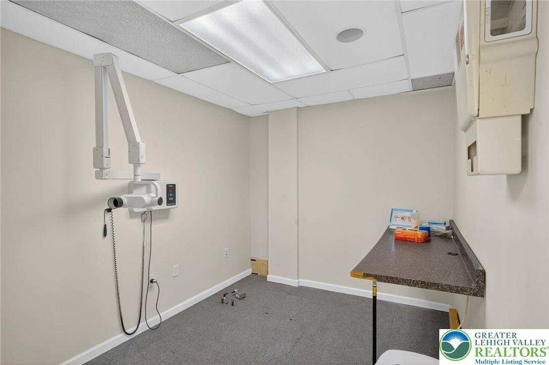 1106 Broadway Bethlehem, PA 18015 - Photo 10 of 25 a room with a table and a chandelier