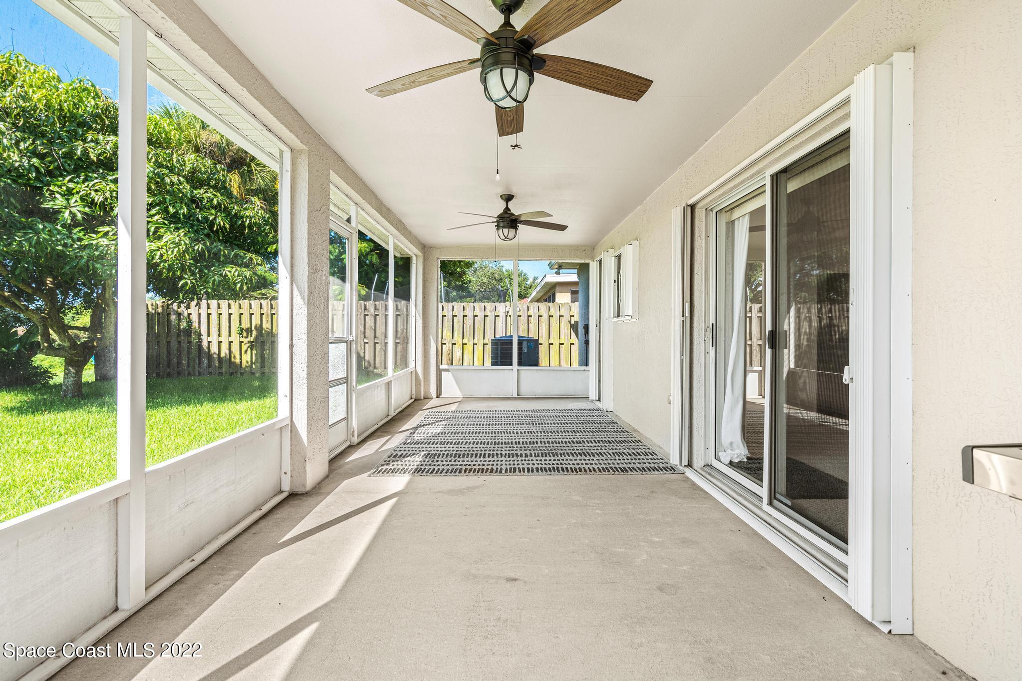 1920 Brookshire Circle Melbourne, FL 32904 - Photo 29 of 41 a view of porch with a floor to ceiling windows and a ceiling fan