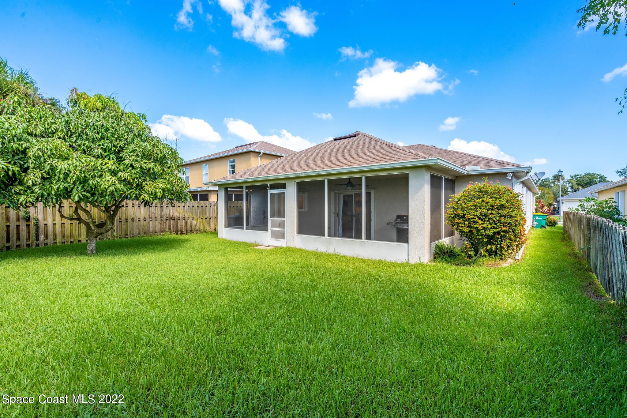 1920 Brookshire Circle Melbourne, FL 32904 - Photo 30 of 41 a view of a house with a big yard