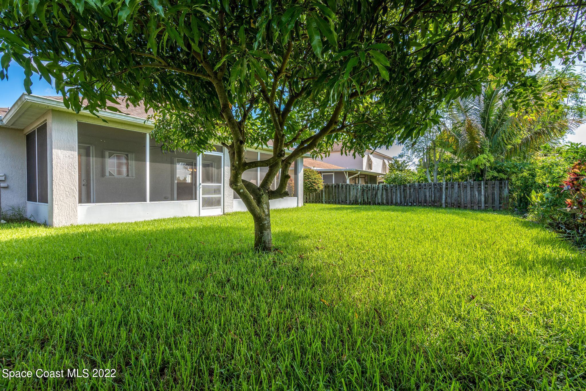 1920 Brookshire Circle Melbourne, FL 32904 - Photo 32 of 41 a view of a house with a backyard