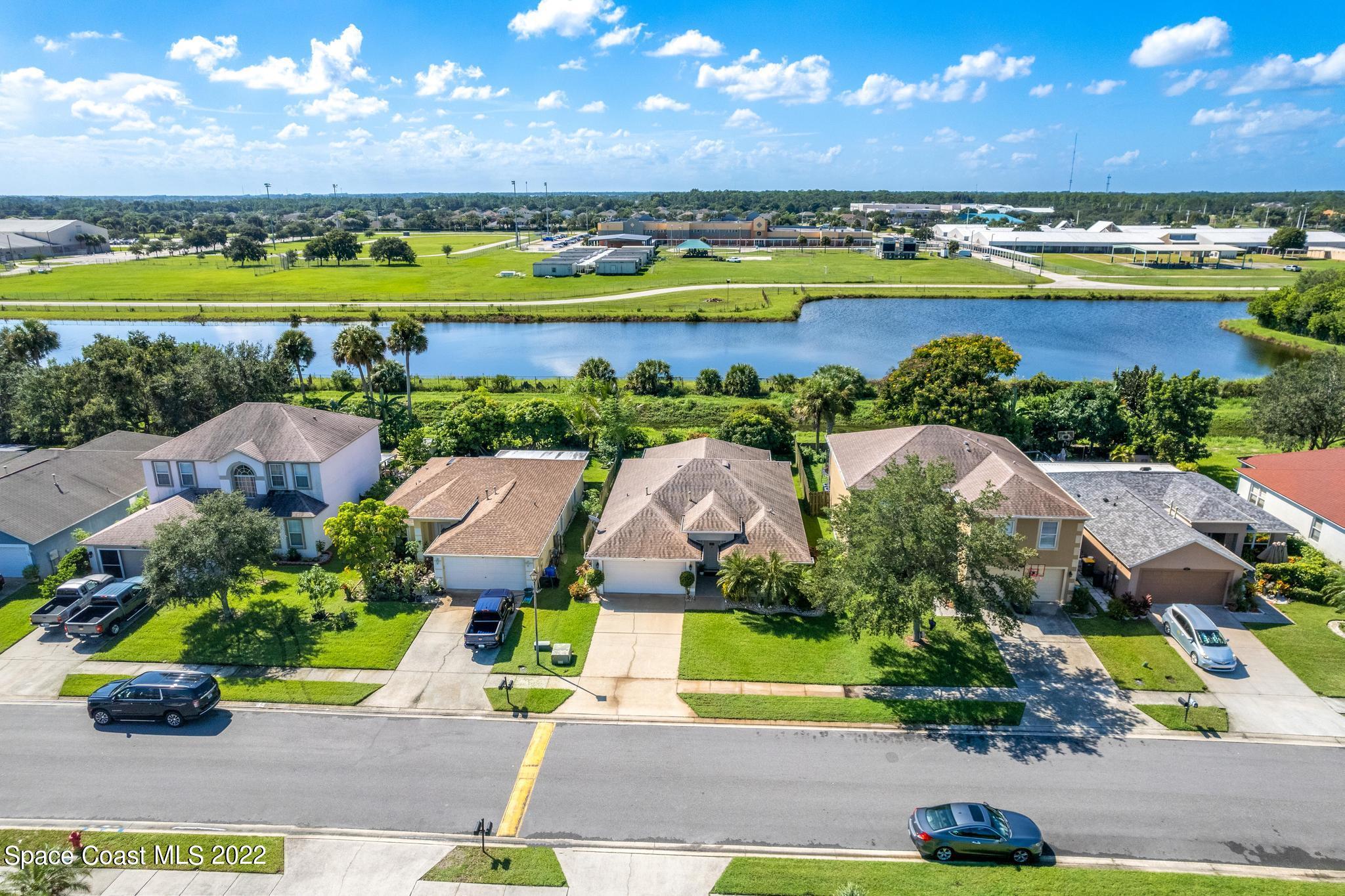 1920 Brookshire Circle Melbourne, FL 32904 - Photo 33 of 41 an aerial view of a house with a garden and swimming pool