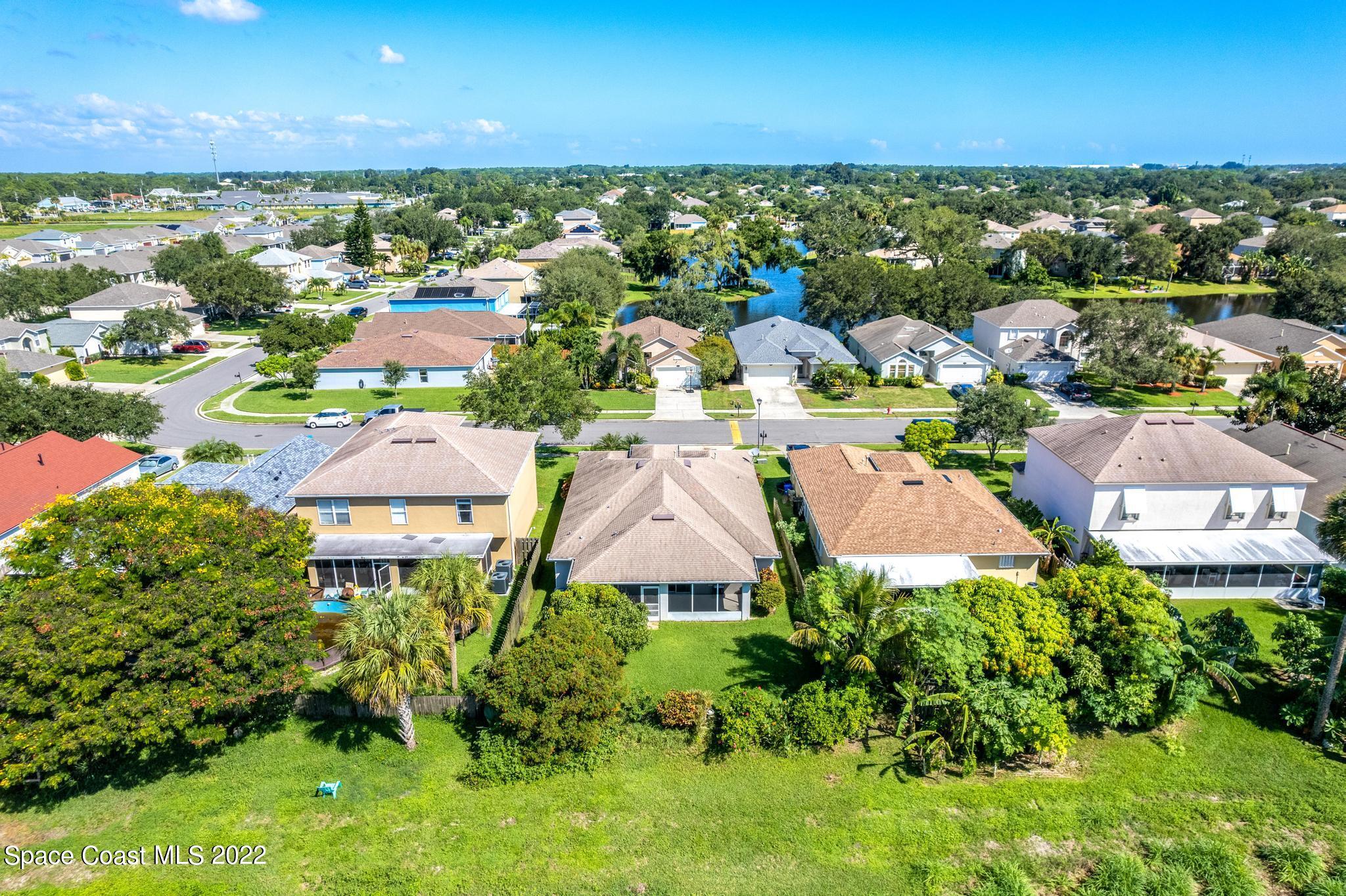 1920 Brookshire Circle Melbourne, FL 32904 - Photo 36 of 41 an aerial view of residential houses with outdoor space and ocean view