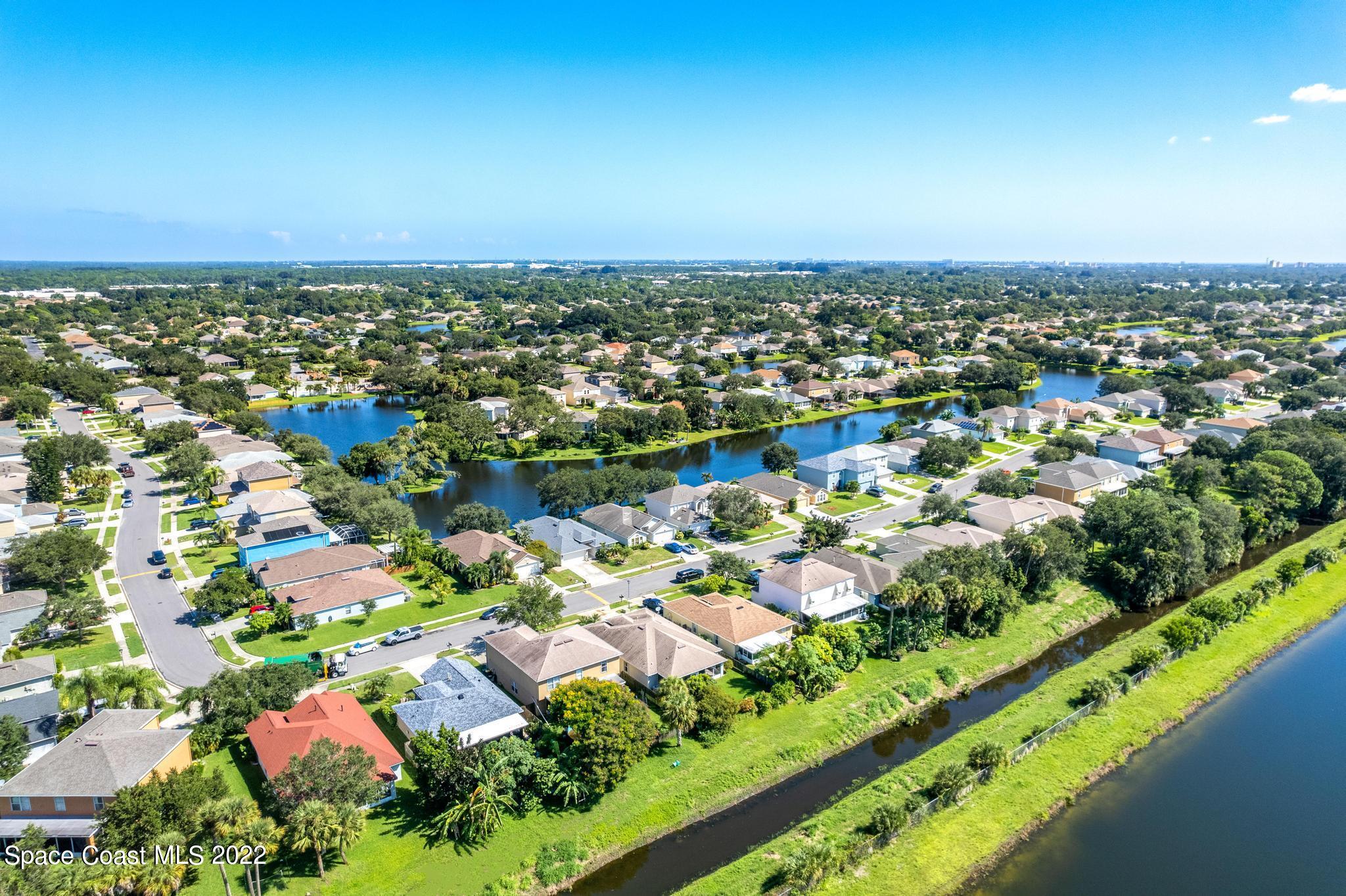 1920 Brookshire Circle Melbourne, FL 32904 - Photo 39 of 41 an aerial view of a city with lots of residential buildings