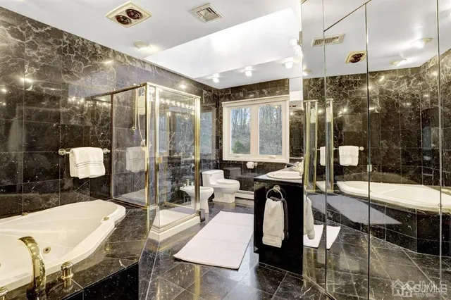 a very nice looking dining room with a large window