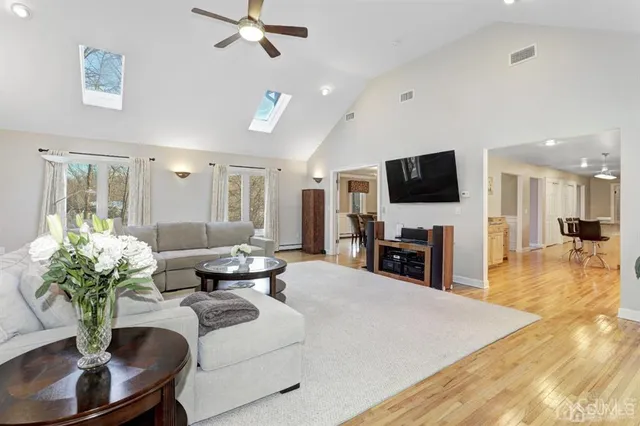 a living room with fireplace furniture and a flat screen tv