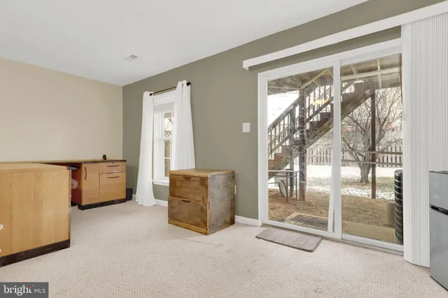 a room with a bed and cabinets