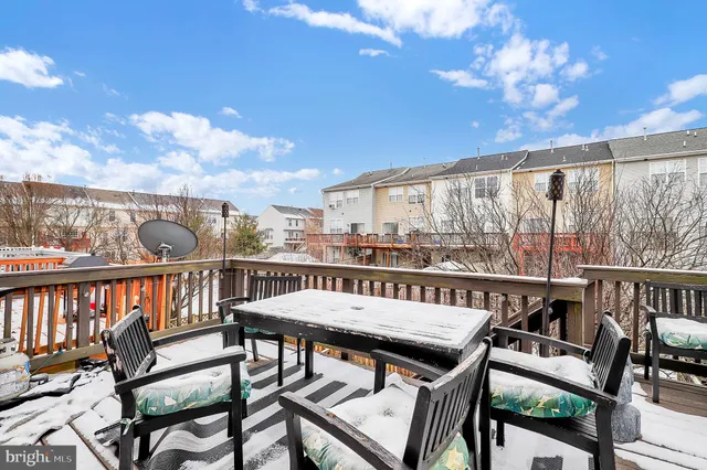 a view of a balcony with wooden fence