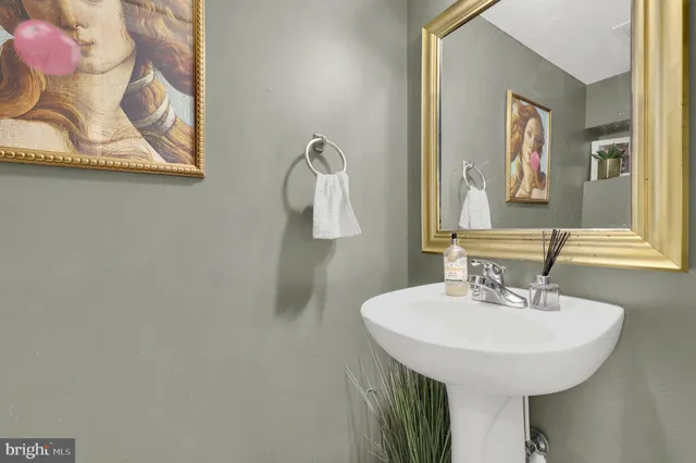 a kitchen with white cabinets and stove