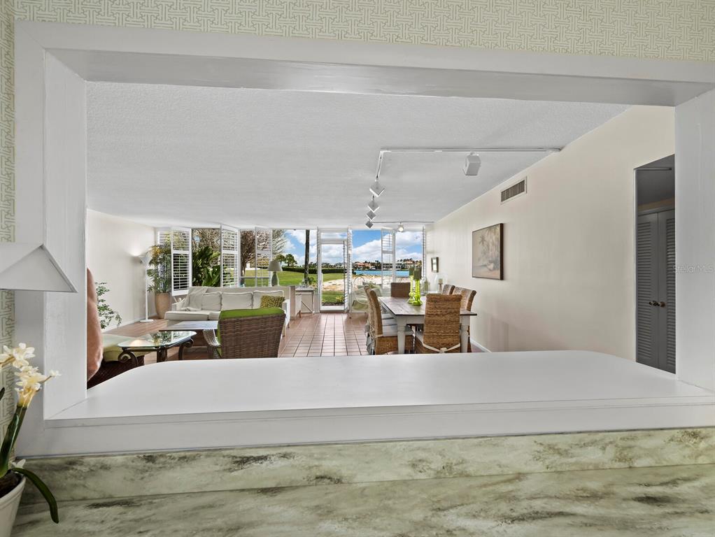 100 Sands Point Road, Unit 108 Longboat Key, FL 34228 - Photo 19 of 46 a living room with furniture and a large window