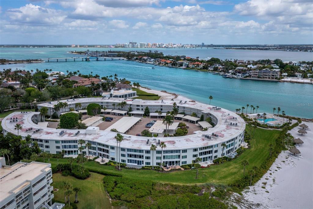 100 Sands Point Road, Unit 108 Longboat Key, FL 34228 - Photo 45 of 46 an aerial view of a house with a garden and lake view