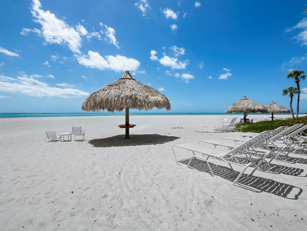 100 Sands Point Road, Unit 108 Longboat Key, FL 34228 - Photo 5 of 46 a view of a terrace with a yard