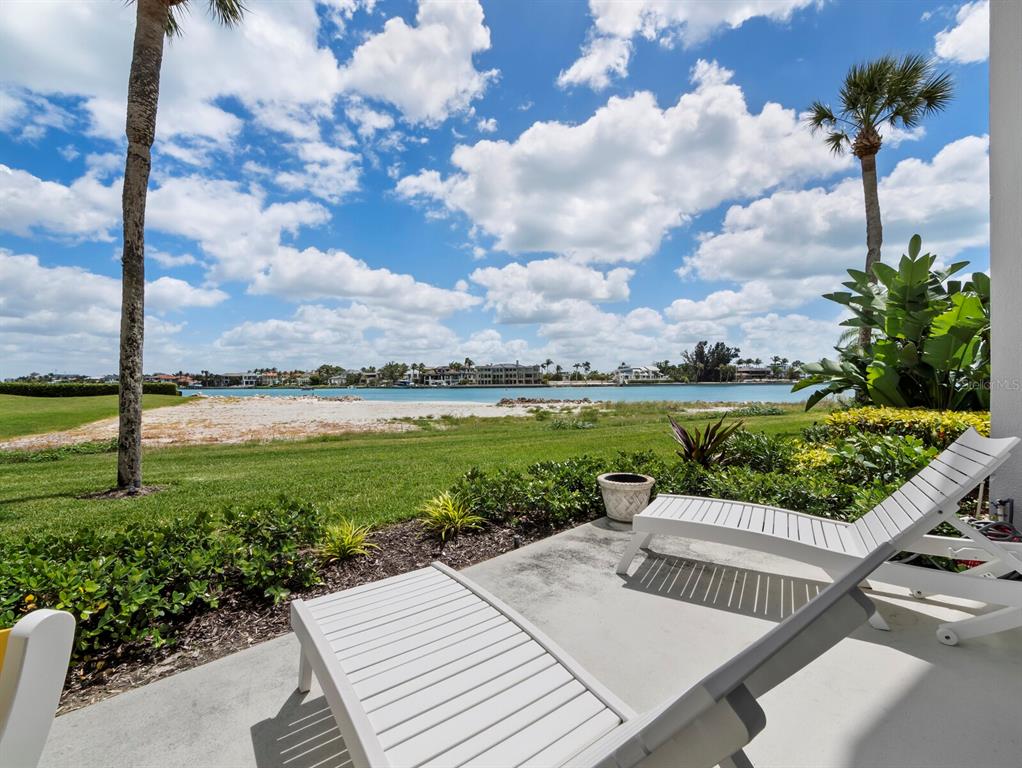 100 Sands Point Road, Unit 108 Longboat Key, FL 34228 - Photo 7 of 46 a view of a patio with a table & chairs