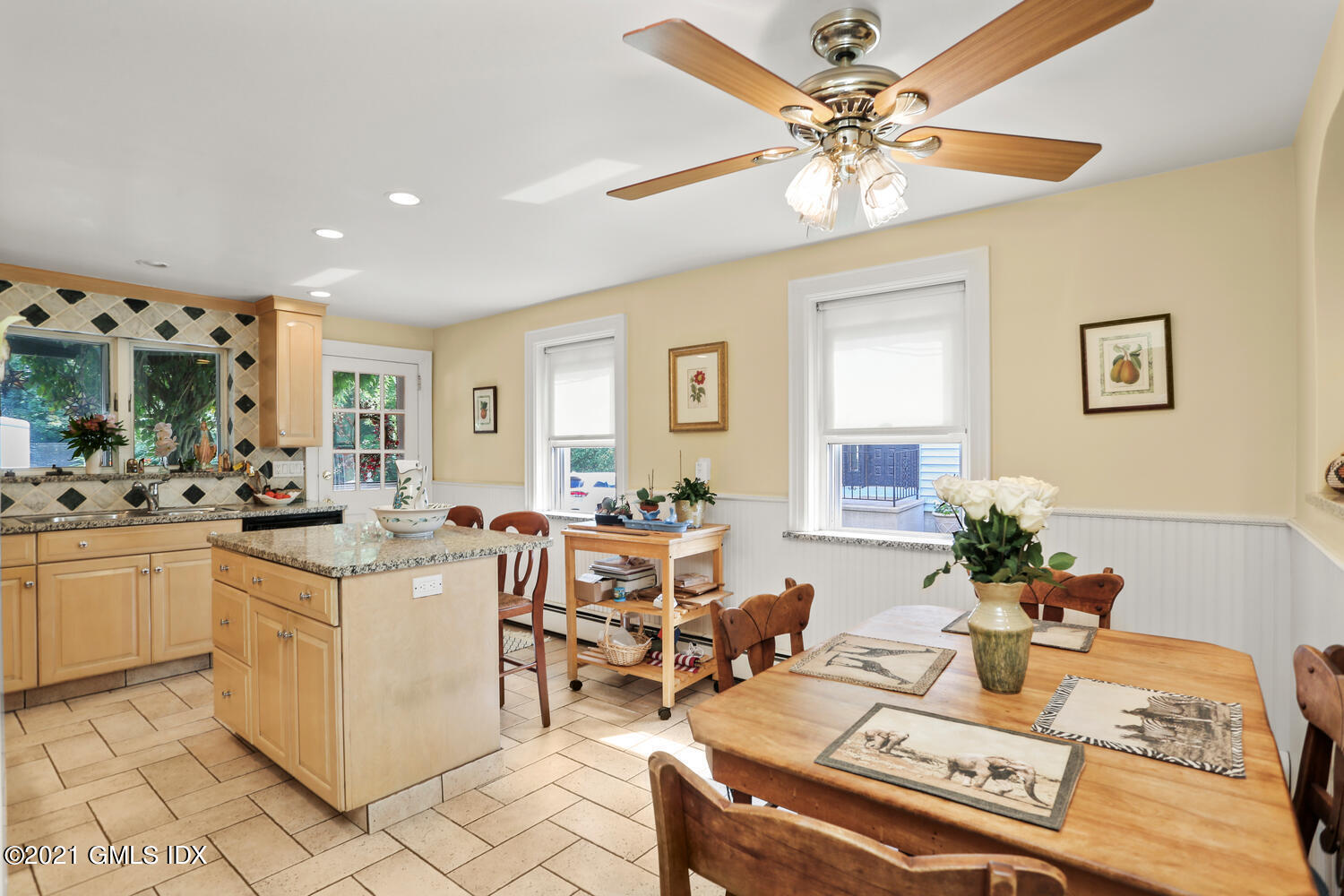 45 Rodwell Avenue Greenwich, CT 06830 - Photo 17 of 42 a living room with kitchen island furniture and a chandelier