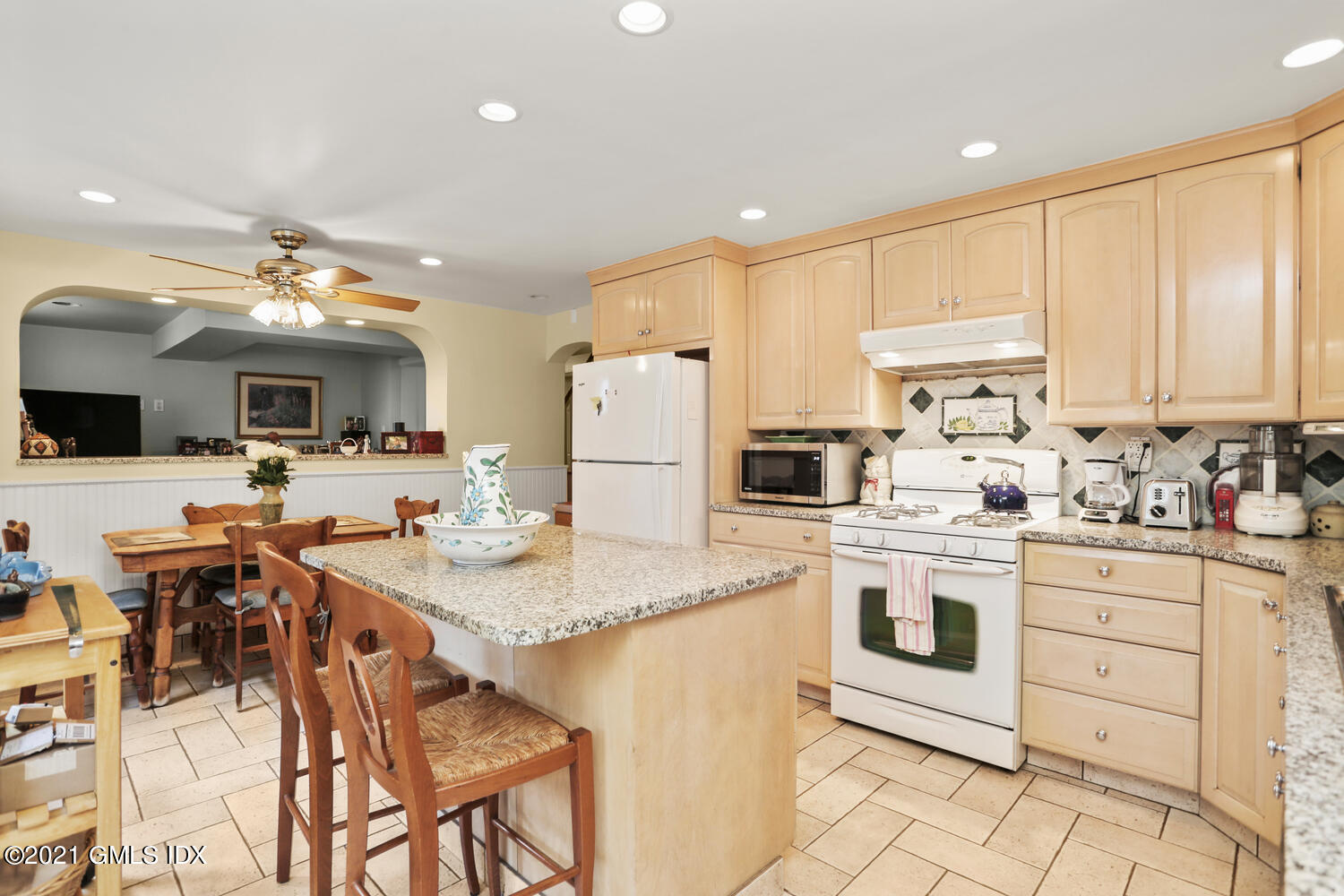 45 Rodwell Avenue Greenwich, CT 06830 - Photo 19 of 42 a kitchen with stainless steel appliances kitchen island granite countertop a sink and cabinets