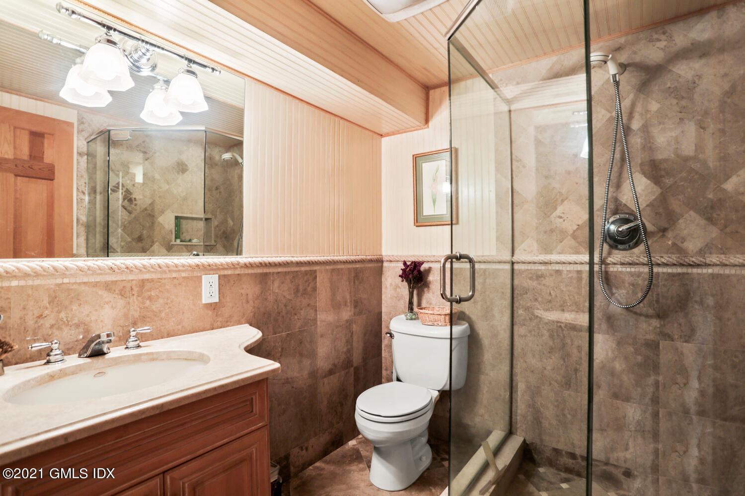 45 Rodwell Avenue Greenwich, CT 06830 - Photo 22 of 42 a bathroom with a sink a toilet and shower